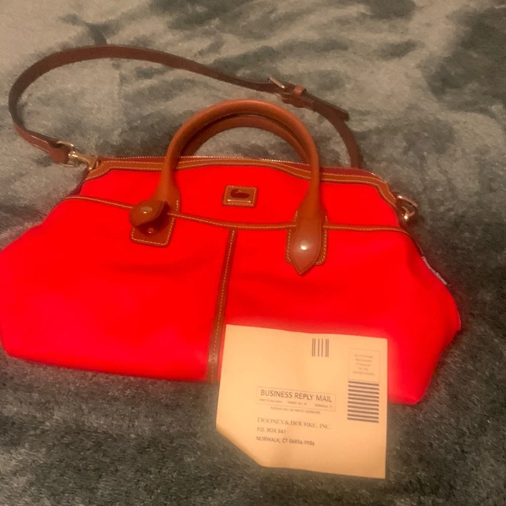 Dooney Bourke med ref blue striped inside. - Picture 1 of 3